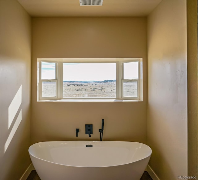 bathroom with a tub