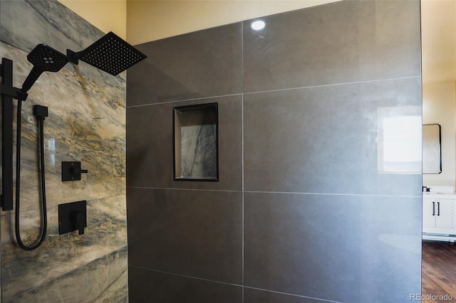 bathroom featuring wood-type flooring and walk in shower