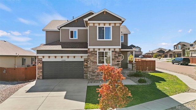 craftsman inspired home with a garage