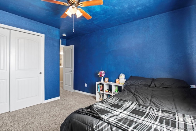 bedroom with a closet, ceiling fan, and carpet floors