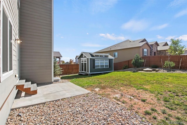 view of yard with a patio and a shed