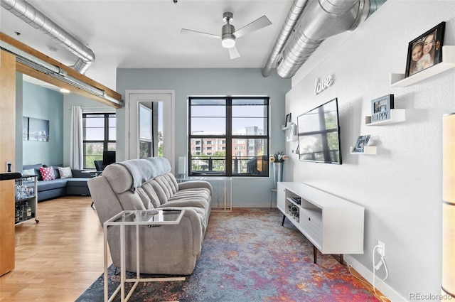 7700 E 29th Ave Unit 304, Denver, CO 80238 - living area featuring a ceiling fan and wood finished floors