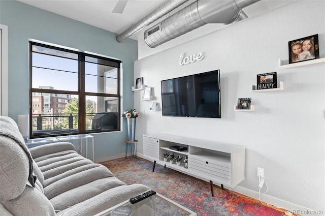 7700 E 29th Ave Unit 304, Denver, CO 80238 - carpeted living area with baseboards