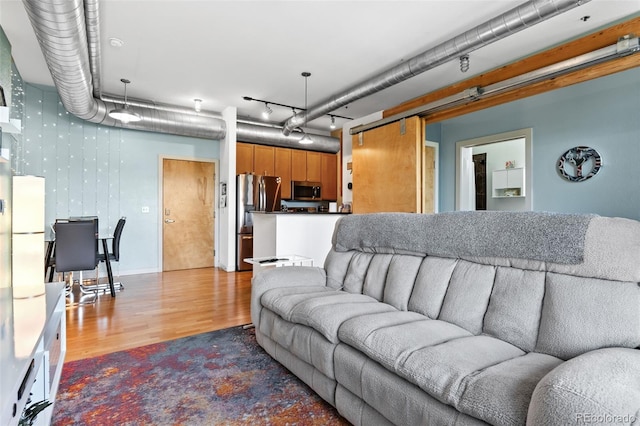 7700 E 29th Ave Unit 304, Denver, CO 80238 - living room featuring wood finished floors