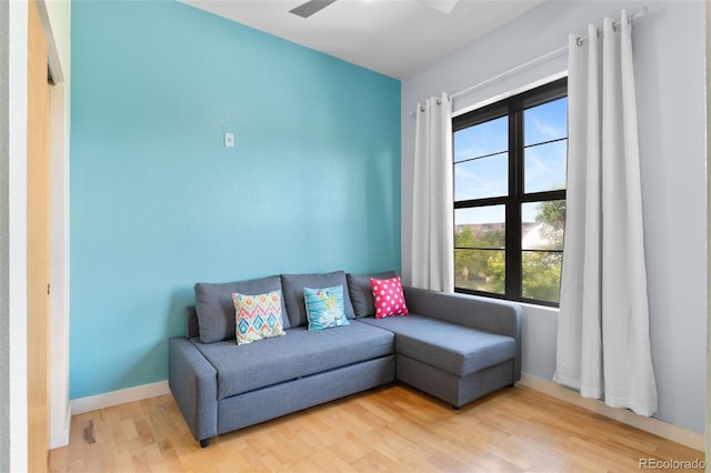 7700 E 29th Ave Unit 304, Denver, CO 80238 - living area with light wood-type flooring and ceiling fan