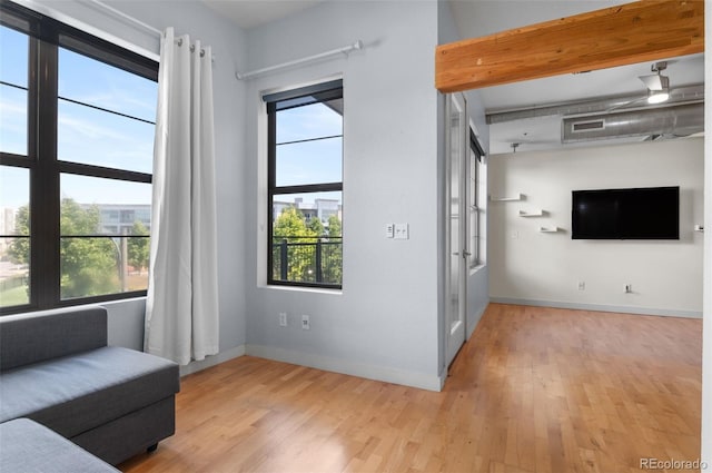 7700 E 29th Ave Unit 304, Denver, CO 80238 - living area featuring light wood-type flooring and baseboards