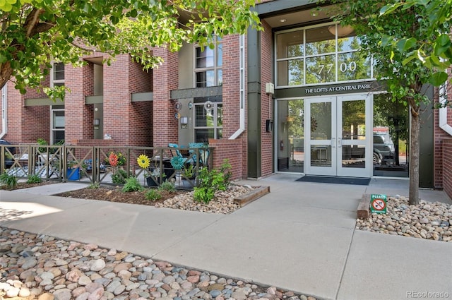 7700 E 29th Ave Unit 304, Denver, CO 80238 - property entrance featuring french doors and brick siding