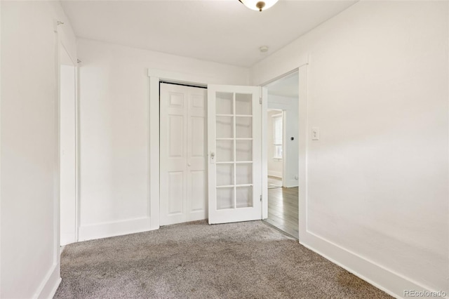 1340 Iola St, Aurora, CO 80010 - unfurnished bedroom featuring carpet floors, a closet, and french doors