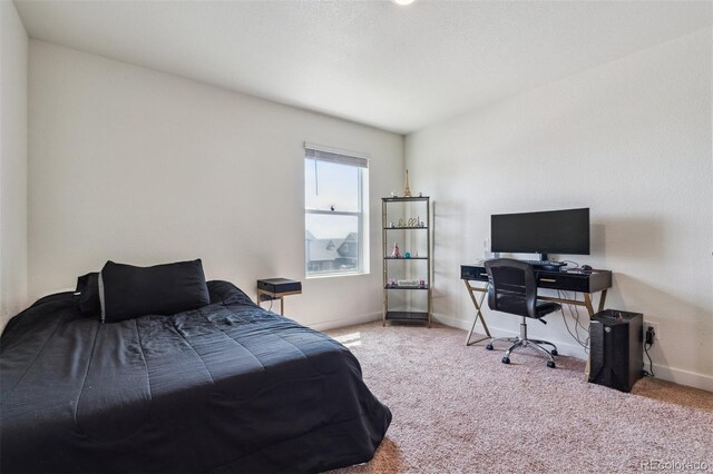 7498 E 157th Pl, Thornton, CO 80602 - bedroom with carpet floors and a desk