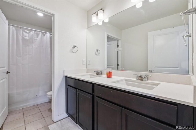 7498 E 157th Pl, Thornton, CO 80602 - bathroom featuring double vanity, curtained shower, and tile patterned floors