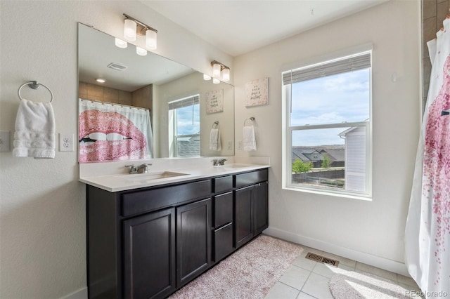 7498 E 157th Pl, Thornton, CO 80602 - bathroom with double vanity and tile patterned floors