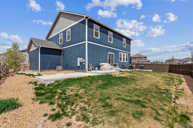 7498 E 157th Pl, Thornton, CO 80602 - rear view of property with a patio area and a fenced backyard