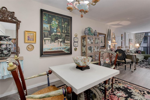 2 Adams St Unit 809, Denver, CO 80206 - dining room featuring wood finished floors and a chandelier