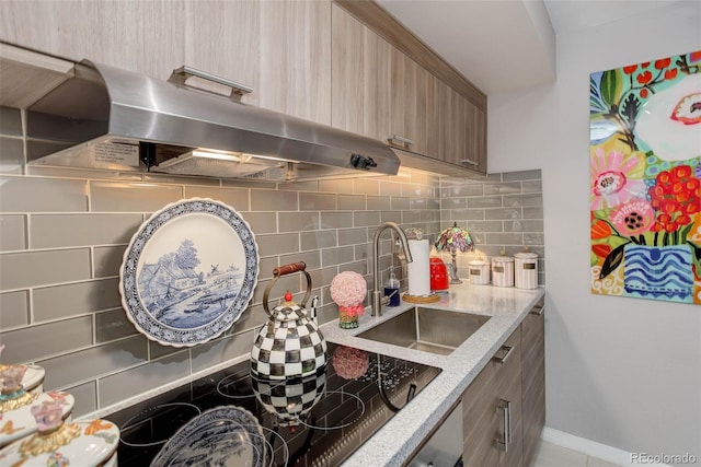2 Adams St Unit 809, Denver, CO 80206 - kitchen with exhaust hood, backsplash, modern cabinets, and light stone countertops