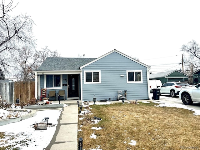 view of front facade with a lawn and a porch