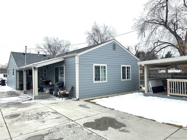 view of snow covered house