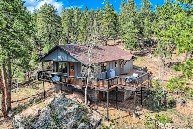 28669 Mountain View Rd, Conifer, CO 80433 - back of house with roof with shingles and a wooden deck