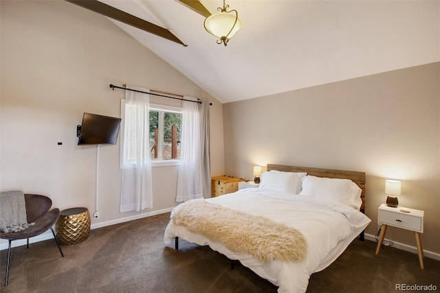 bedroom featuring dark colored carpet and high vaulted ceiling