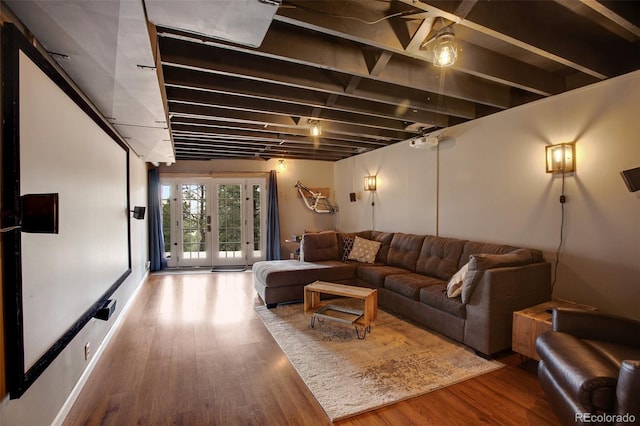 living room with hardwood / wood-style flooring and french doors