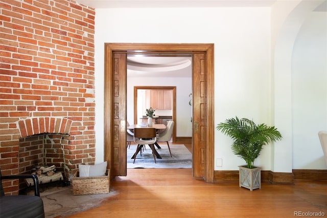 2845 Quitman St, Denver, CO 80212 - hallway with wood finished floors, baseboards, and arched walkways