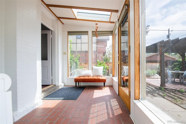 2845 Quitman St, Denver, CO 80212 - sunroom featuring a skylight, brick flooring, and lofted ceiling