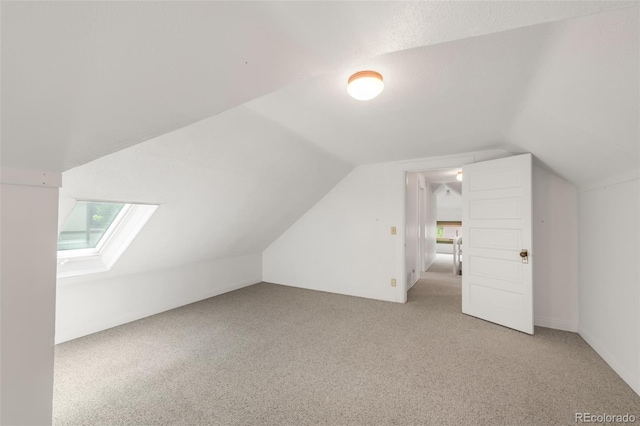 2845 Quitman St, Denver, CO 80212 - bonus room with vaulted ceiling, a skylight, and light carpet