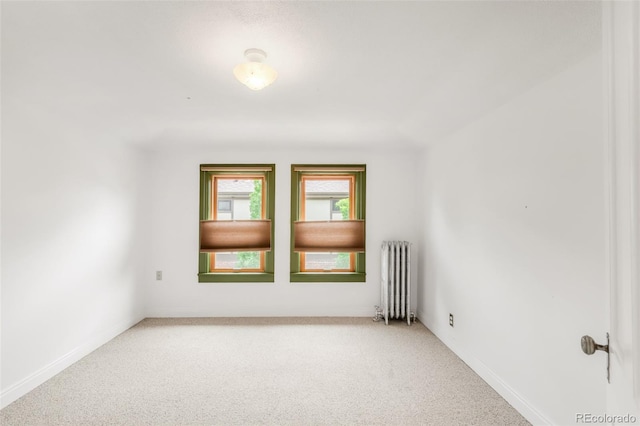2845 Quitman St, Denver, CO 80212 - spare room featuring radiator, light colored carpet, and baseboards