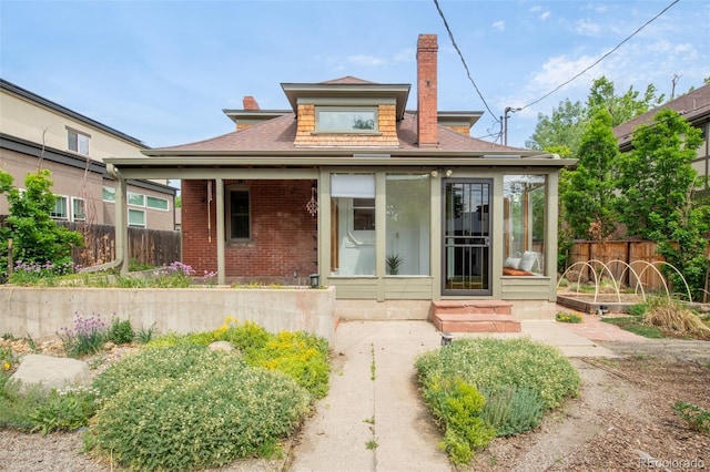 2845 Quitman St, Denver, CO 80212 - back of property with a chimney, brick siding, a shingled roof, and entry steps