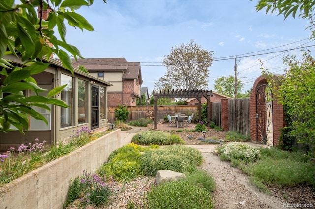2845 Quitman St, Denver, CO 80212 - fenced backyard featuring a pergola, a patio, and a sunroom