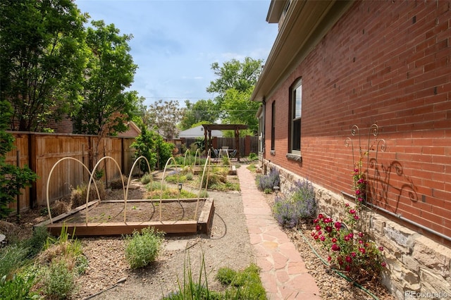 2845 Quitman St, Denver, CO 80212 - fenced backyard featuring a vegetable garden