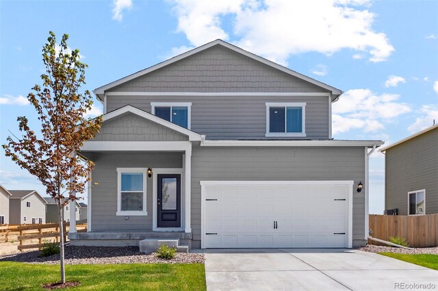 view of front of property with a garage