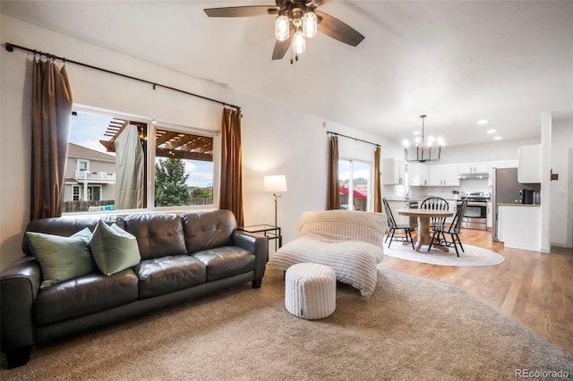 2204 Reed Grass Way, Colorado Springs, CO 80915 - living area featuring a chandelier, a ceiling fan, light wood-type flooring, and recessed lighting