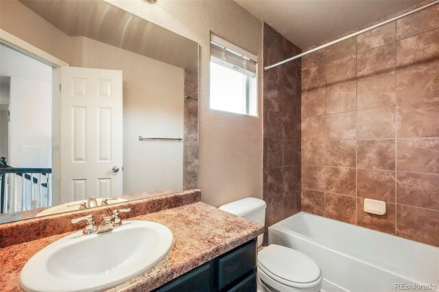 2204 Reed Grass Way, Colorado Springs, CO 80915 - full bath featuring toilet, vanity,  shower combination, and a textured wall