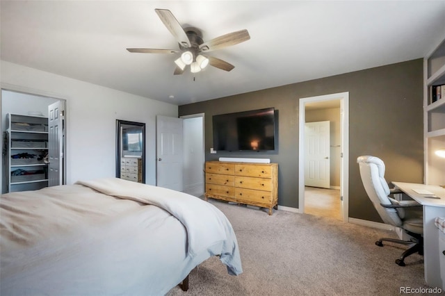 2204 Reed Grass Way, Colorado Springs, CO 80915 - carpeted bedroom with a desk, baseboards, ceiling fan, and a spacious closet
