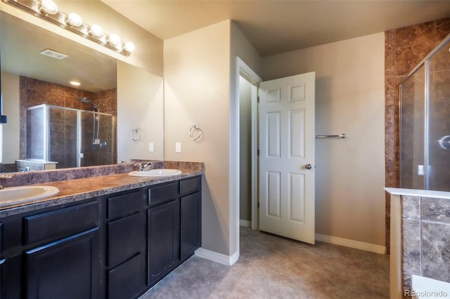 2204 Reed Grass Way, Colorado Springs, CO 80915 - bathroom featuring a stall shower, double vanity, and baseboards