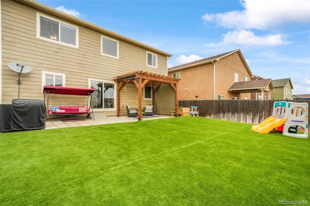 2204 Reed Grass Way, Colorado Springs, CO 80915 - rear view of house featuring a pergola, a patio, and a playground