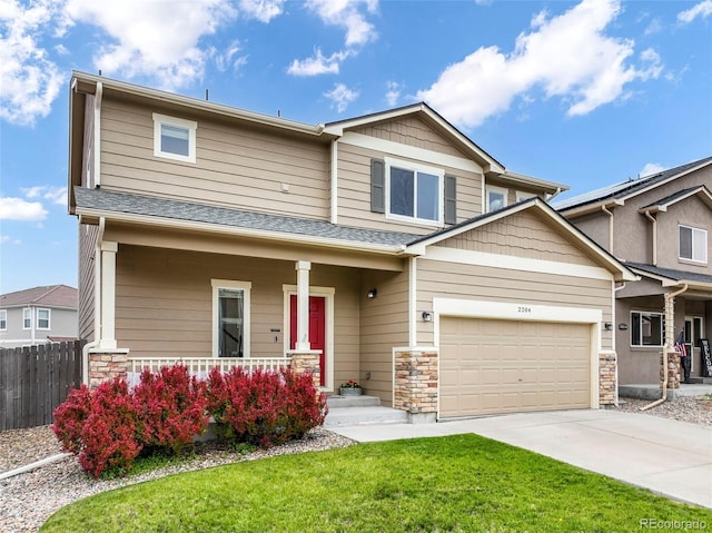 2204 Reed Grass Way, Colorado Springs, CO 80915 - craftsman house featuring a porch, concrete driveway, stone siding, and a garage