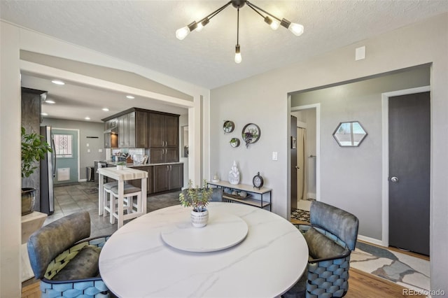 dining area with a textured ceiling