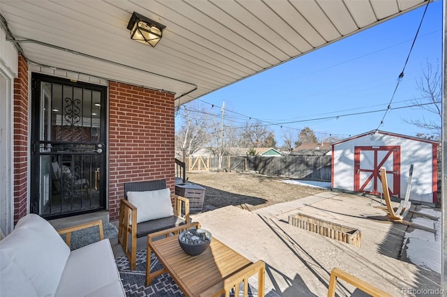 view of patio with a storage unit