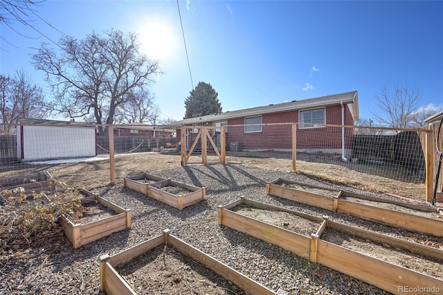 rear view of house featuring an outdoor structure