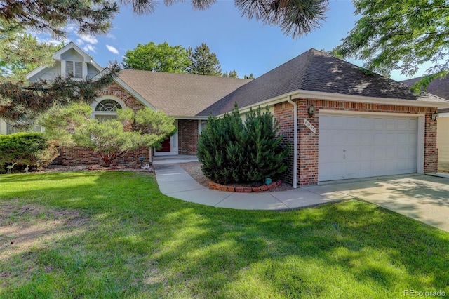 6055 W Warren, Lakewood, CO 80227 - view of front of home featuring brick siding, roof with shingles, an attached garage, a front yard, and driveway