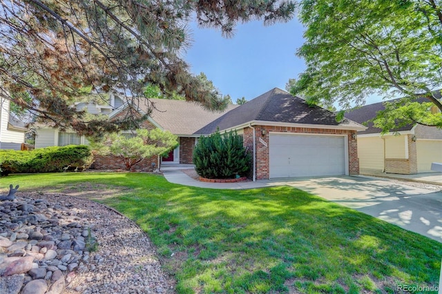 6055 W Warren, Lakewood, CO 80227 - view of front of house featuring brick siding, an attached garage, concrete driveway, a front lawn, and roof with shingles