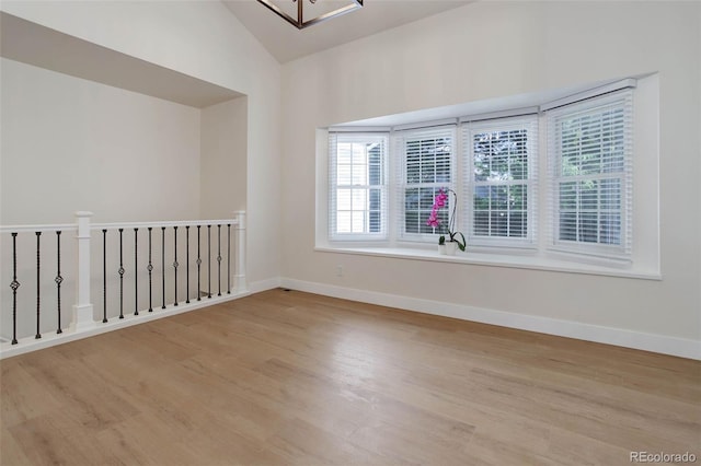 6055 W Warren, Lakewood, CO 80227 - empty room featuring wood finished floors and lofted ceiling