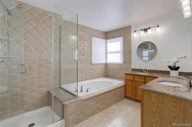 6055 W Warren, Lakewood, CO 80227 - full bath featuring vanity, a stall shower, a bath, and tile patterned flooring