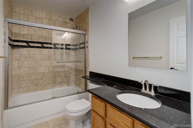 6055 W Warren, Lakewood, CO 80227 - full bath with vanity, enclosed tub / shower combo, and tile patterned floors
