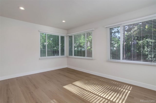 6055 W Warren, Lakewood, CO 80227 - unfurnished room with wood finished floors and recessed lighting