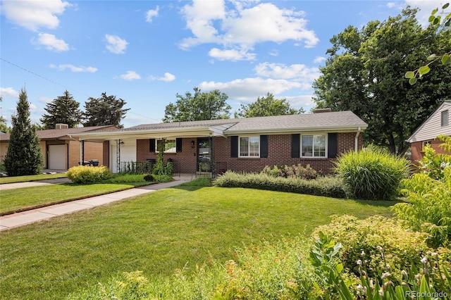 745 S Glencoe St, Denver, CO 80246 - ranch-style house with brick siding, a garage, a front yard, covered porch, and driveway