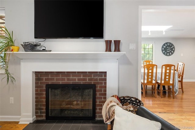 745 S Glencoe St, Denver, CO 80246 - detailed view of a brick fireplace and wood finished floors
