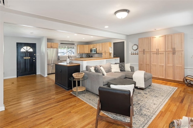 745 S Glencoe St, Denver, CO 80246 - living area featuring light wood-style floors and recessed lighting