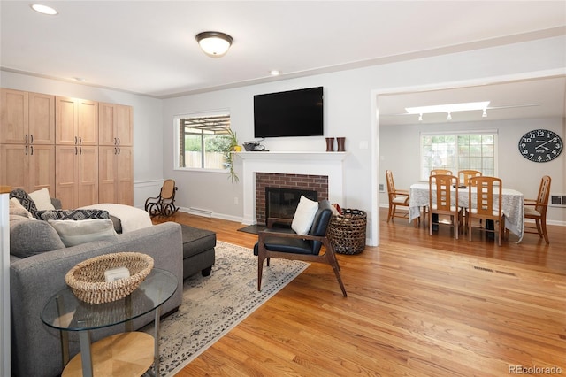 745 S Glencoe St, Denver, CO 80246 - living area with light wood-style floors, recessed lighting, and a fireplace